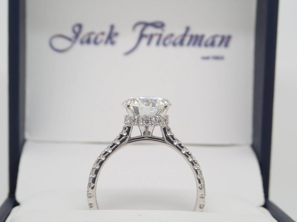 Round hidden halo diamond engagement ring